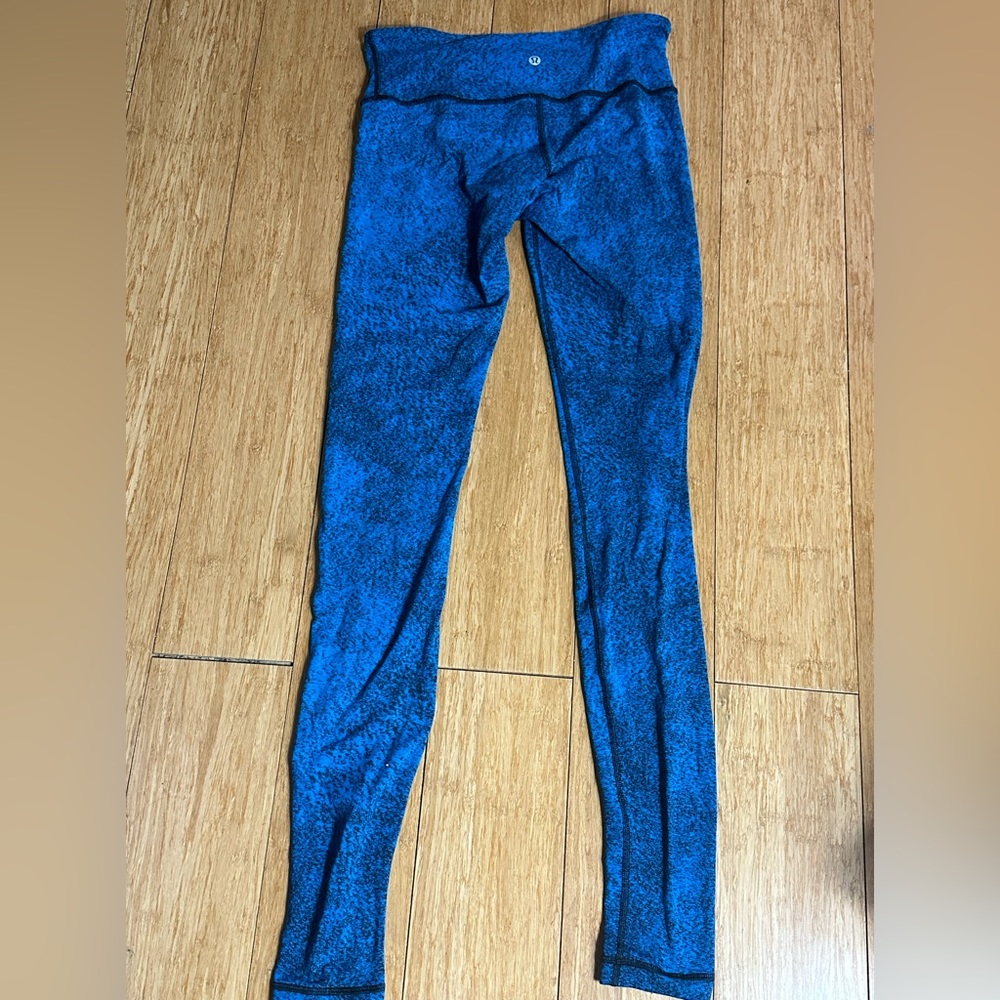 Blue and Black Lululemon Athletica high rise leggings.